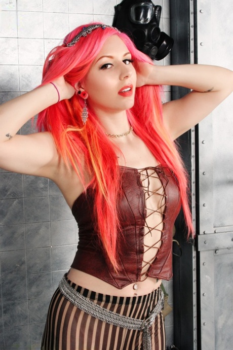 Solo girl with dyed haired Annalee Belle shows her tattooed body in the nude