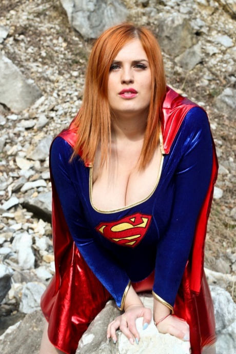 Thick redhead Alexsis Faye releases her giant tits from Superman osutfit