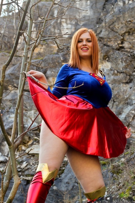 Thick redhead Alexsis Faye releases her giant tits from Superman osutfit