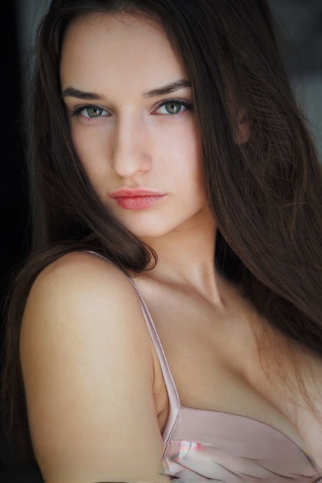 Hot brunette teen Gloria Sol models nude after removing bra and panty ensemble