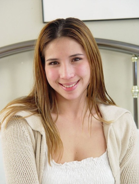 Petite teen slowly removes her clothes until she's totally naked on her bed