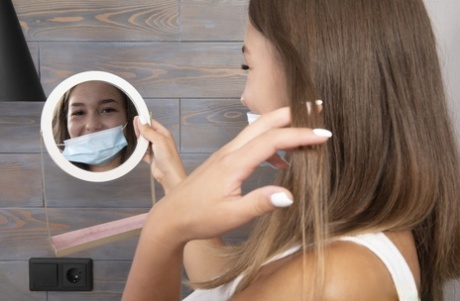 Nice teen Hazel Grace removes a surgical mask and clothing before masturbating