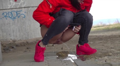 Solo girl Billie takes a badly needed piss underneath an overpass
