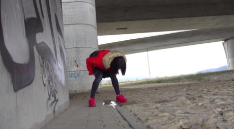 Solo girl Billie takes a badly needed piss underneath an overpass