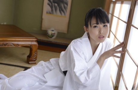 Japanese beauty Manami Ueno goes nude in white socks on throw cushions