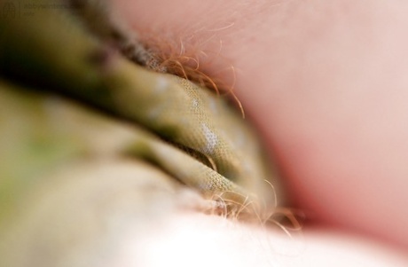 Redhead punk chick Isadora fondles all natural boobs and fingers hairy twat