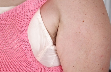 Experienced lady Janey lets pubic hairs peek out from under white panties
