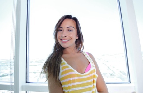 Petite brunette Kaylee Haze undresses her sexy and tiny booty