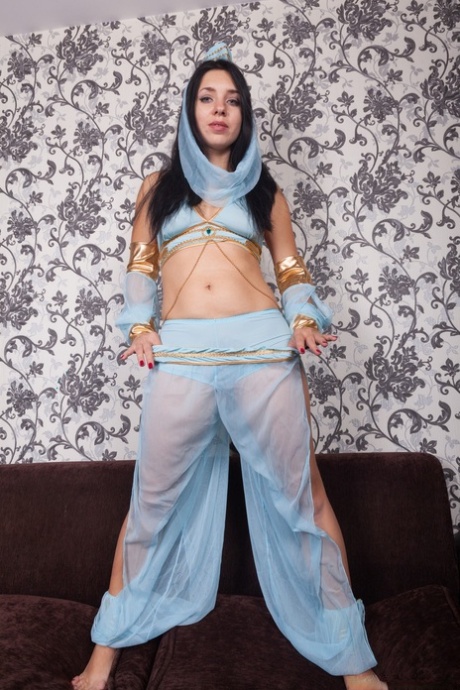 Adorable belly dancer Tanita reveals her hairy crotch and spreads it wide open