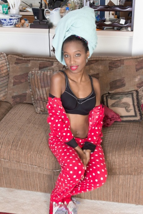Slender ebony with tiny titties Saf strips and poses naked after shower