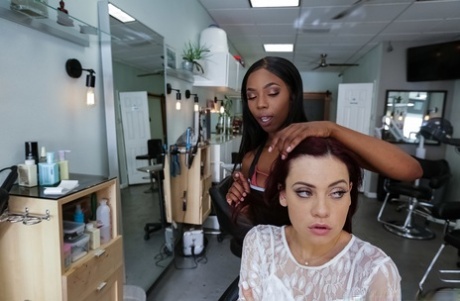 Interracial lesbian pussy play by Sabina Rouge and ebony babe Sarah Banks