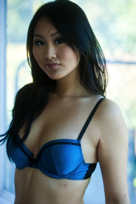 Hot Asian babe Evelyn Lin reveals her tits and tasty bald cunt in high heels