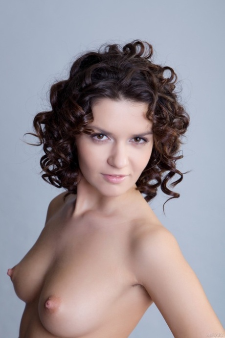Sexy babe with curly hair Roza A flaunts her hairy pussy and small boobs