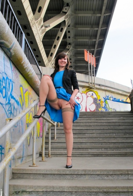 Sexy girl with a hot figure Jeny Smith exposes her fat ass under the bridge