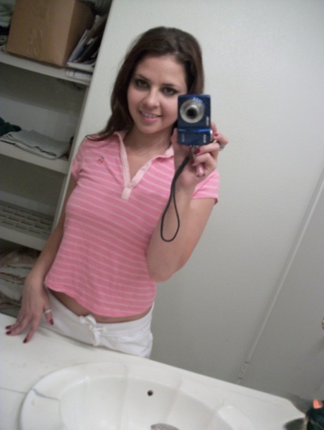 Cute teen amateur Cali Logan poses naked and teases with her nice big tits