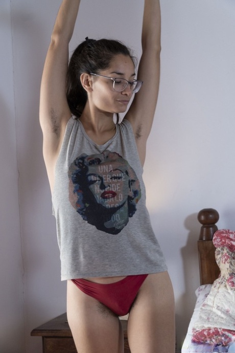 Nerdy amateur Tiffany reveals her long hard nips and hairy pussy on a bed
