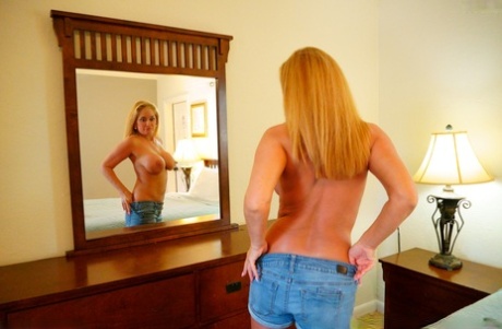 Sexy amateur MILF Wendy goes topless in the mirror & teases with her big tits