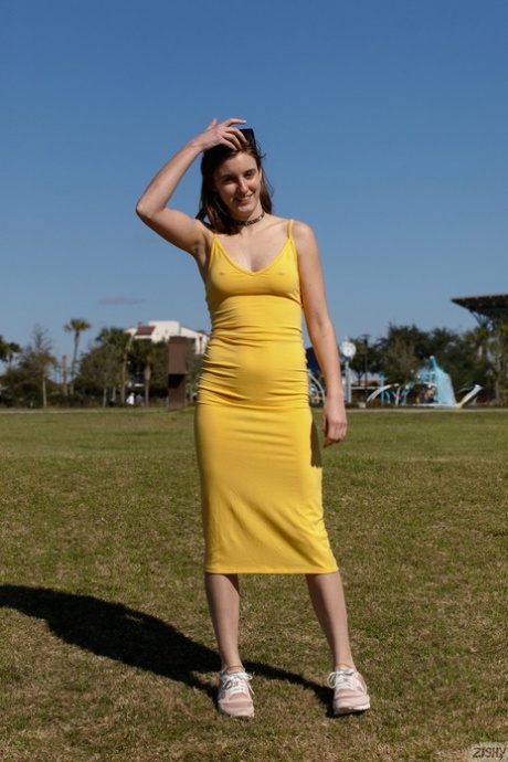 Naughty amateur flashes a pantyless upskirt and her natural tits outdoors