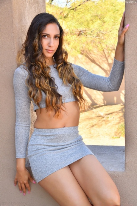 Tall slim babe Angelena loses her skirt and slides a dildo in her love hole